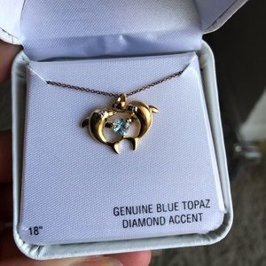 Beautiful gold dolphin necklace with blue topaz
